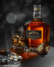 a bottle of jack daniels single barrel whiskey next to a glass of whiskey