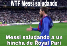 a soccer player is standing on a field with a caption that says wtf messi salutando