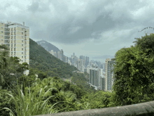 a view of a city from a hillside with a building that says ' victoria ' on it