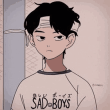 a sad boy with a bandage on his head is wearing a sad boys t-shirt .