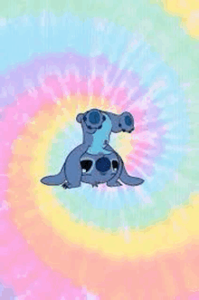 a tie dye background with a cartoon character sitting on top of another cartoon character .