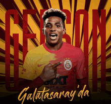 a poster with a soccer player pointing to the word galatasaray