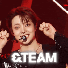 a person with a microphone in their mouth and the word team in white letters