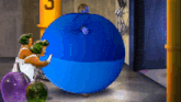 a cartoon of a man being blown up by a blue balloon