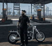 a man standing next to a motorcycle in front of a gas station