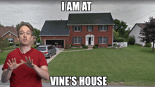 a man standing in front of a house that says i am at vines house