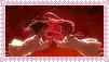 a couple of people standing next to each other in a dark room with a red background .