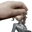 a hand is touching a statue of a woman in a suit .