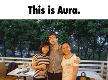 a man and two women are posing for a picture and the caption says this is aura