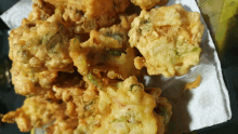 fried food on a paper towel on a table