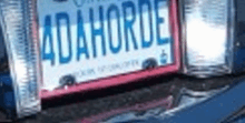 a blue car with a license plate that says adahorde on it