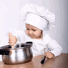 a little girl in a chef 's hat stirs a pot