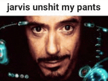 a close up of a man 's face with the words `` jarvis unshit my pants '' below it .