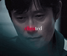 a close up of a man 's face with the word cheated written above him