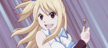 a girl with blonde hair is holding a key