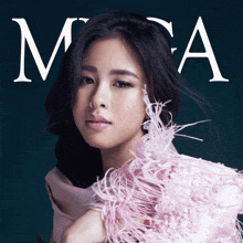 a woman wearing a pink feathered top is on the cover of a magazine called mca