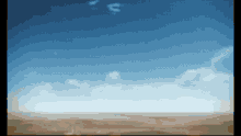 a pixelated image of a blue sky with a few clouds