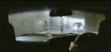 a person is driving a car through a tunnel and looking out the window