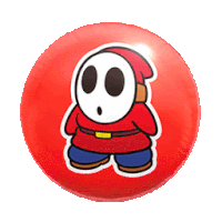 a red circle with a cartoon character with a skull face on it