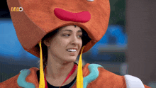 a woman in a gingerbread man costume with bbbo written on the bottom right