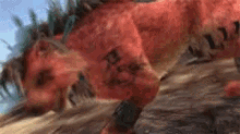 a close up of a red animal with the letter x on its chest