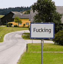 a sign on the side of a road that says " fucking "