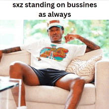 a man is sitting on a couch with his legs crossed and a caption that says sxz standing on bussines