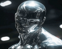 a silver statue of a man with a skull on his head