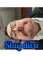 a man with glasses and a beard has the words slay diva above his face