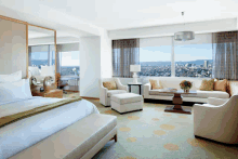 a hotel room with a view of the city and mountains