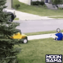 a child is sitting in the grass next to a lawn mower that says moon sama on the bottom