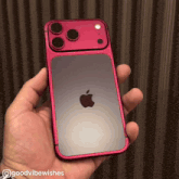 a person holding a red iphone with the words goodvibewishes written on the bottom