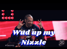 snoop dogg giving a peace sign with the words " wud up my nizzle " below him