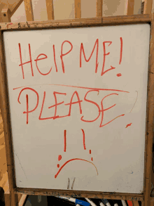 a white board has help me please written on it