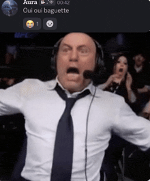 a man wearing headphones and a tie is screaming with the words aura oui oui baguette on the bottom