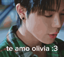 a close up of a person 's face with the words te amo olivia : 3