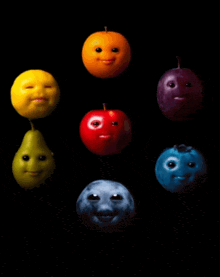 a group of fruits with faces on them