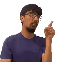 a man wearing glasses and a blue shirt points up