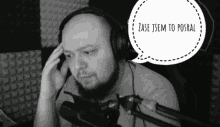 a man wearing headphones talks into a microphone with a speech bubble that says zase jsem to posral