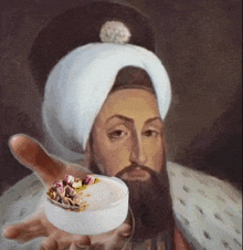 a painting of a man with a beard and turban holding a bowl of food