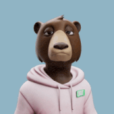 a brown bear wearing a pink hoodie with okay written on it