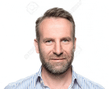 a man with a beard wearing a striped shirt is smiling for the camera