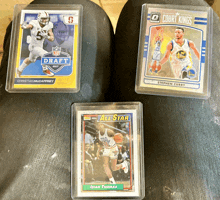 three sports cards one of which is a stephen curry all star