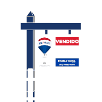 a re / max sign with a hot air balloon on top of it