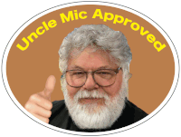 a man with glasses and a beard is giving a thumbs up and the words " uncle mic approved " around him