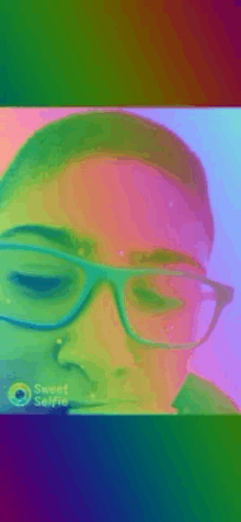 a person wearing glasses is taking a sweet selfie with a rainbow background