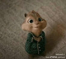 a cartoon chipmunk wearing a green pajama top