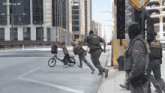 a group of police officers are running across a street