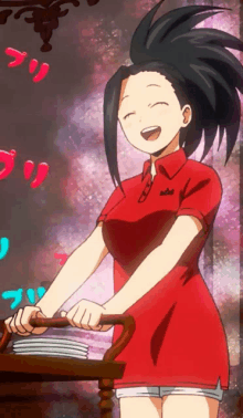 a girl in a red shirt is smiling while holding a tray