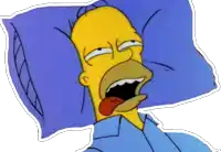 homer simpson is laying in bed with his tongue out